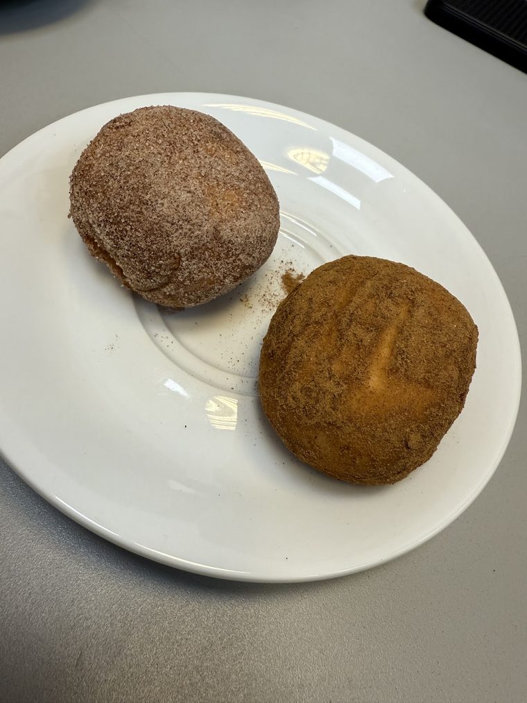 Cinnamon-sugar dusted doughnut buns on a plate